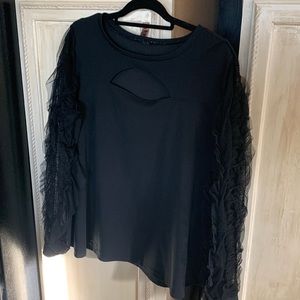 Beautiful black top with peephole and ruffled sleeves